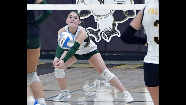 emma mcquarter (#6, above) digs out a Falcon shot last Wednesday.