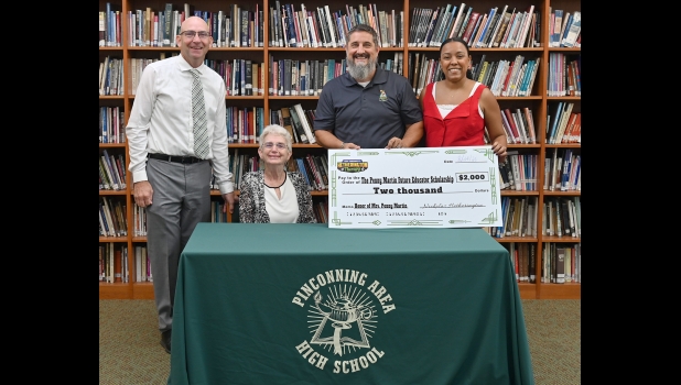 THE PENNY MARTIN EDUCATION SCHOLARSHIP will be awarded annually to a PHS student pursuing a degree in education. Pictured are (l-r): Superintendent Andy Kowalczyk, Penny Martin, Nick Hetherington, and Marilia Hetherington. 