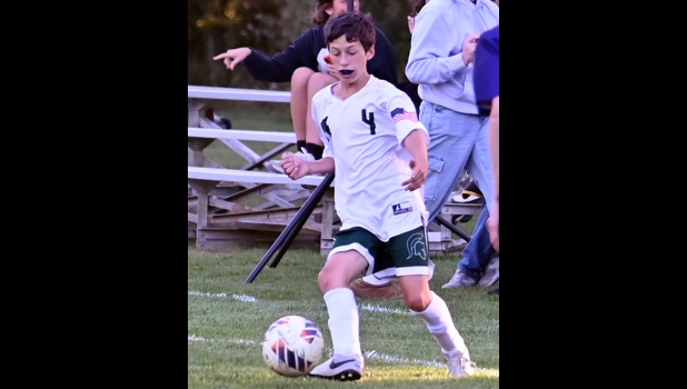 ZANDER FABERA (#4) his teammates in playing a complete game against CBA last week. The team was only able to field 11 healthy players.