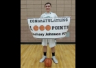 ZACH JOHNSON was honored after Thursday’s 49-28 District Semi-Final win over Harrison. Johnson became the first Pinconning Boys Basketball player to reach 1,000 points. --Courtesy Photo