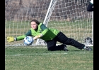 AINESLEY SYLVESTER (#1) makes a diving save in Thursday’s blustery game against Hemlock. She made 18 saves, including one on a Penalty Kick, in the loss.										 --Journal Photo