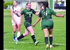ALLISON FORK (#9) celebrates her second goal in the first 20 minutes of Monday’s 3-0 shutout win, as the Hemlock player in the background also reacts