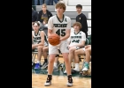 ANDREW WILSON (#45) lines up one of his two 3-pointers on Wednesday evening against Harrison. He scored 12 points on the night. --Journal Photo