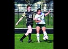 ARIANA BUSTAMANTE (#5) gets one of her 5 shots away against the Lancers last week