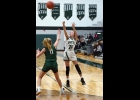 ARIEL HOLSTINE (#24) takes a shot against Clare in the Spartans’ Friday night home loss. --Journal Photo