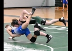 ARTHUR DENNISON drops his opponent from Oscoda last Friday in the second of two meets hosted by the Spartan Varsity Wrestling Team. With the small numbers on the team this season, team results haven’t appeared good, but several individuals are expected to progress to State Finals. --Journal Photo