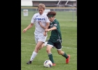 ASHTON ENCISO (#2) battles a Gladwin player to send a pass to Tony Holstine for Pinny’s first goal last Tuesday.
