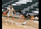 AUSTIN LUPKE (#2) trips up the Bluejays defender from the point in Friday’s Coming Home game. The Spartans fell to Shepherd, 40-48. --Journal Photo