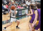 AYDEN LALONDE (#21) works the ball against Farwell on Thursday in the Spartans’ 52-30 win over the Eagles. --Journal Photo