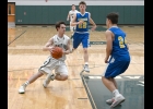 BRADEN O’BRIEN (#3) tries to cut inside the Hornet defender for a shot in Thursday evening’s Senior Night Contest against Harrison. The Spartans came out on top, 69-53. --Journal Photo