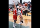 BRADEN SLOWINSKI (#11) drives for a layup against Beaverton on Tuesday. --Journal Photo