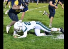 BRADEN SLOWINSKI (#24, left) goes for the legs of the Valley Lutheran runner, making the tackle of Friday night. --Journal Photo
