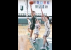 BRADY LUPCKE (#2) drives into the paint for 2 of his team-leading 16 points in Monday’s District win over the Hemlock Huskies. --Journal Photo