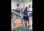 BRADY LUPKE (#2) throws up a layup against Gladwin on Thursday. Lupke led the Spartans with 14 points.			     	           --Journal Photo