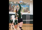 BRIELLE HERNER (#8, above) and MADDY SHOULTES (#4, below) both go up for kills in the Spartans’ 1-3 loss against Meridian on Monday night. --Journal Photo