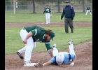 BROC BODRIE (#30) makes the tag to pick off the runner at first. --Journal Photo