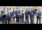 LOCAL POLITICIANS and AT&T PIONEERS met at the Bay-Arenac Intermediate School District to provide backpacks and school supplies to local Superintendents for their students. 		                      --Courtesy Photo