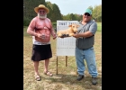 Jon Mckinnon accepts the “Udderly Embarrassing” trophy for winning the Losers’ Bracket. McKinnon also won the club’s Senior Amish Body Building Championship held later that night. --Courtesy Photo