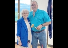 DURING THE RECENT PINCONNING TOWNSHIP MEETING, Rose Pomaville (left) presented her son, Township Supervisor Paul Pomaville (right), with a gavel, made by Paul’s brother, and used by his father Lawrence during the nearly 30 years he served as Fraser Township Supervisor. Lawrence’s father, also named Lawrence, had previously also held the position of Fraser Township Supervisor, making Paul the third generation of the family to represent their communities in Northern Bay County. --Courtesy Photo