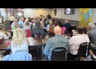 Tim Buechle, Pinconning Native (standing to the right), presented to Rotary and community members about the many things he has experienced living in Alaska. --Courtesy Photo