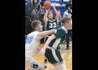 CAL HOLLAND (#32), up from JV, takes a shot against Meridian last Friday.. --Journal Photo