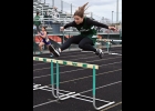 CARMEN STICKEL (shown hurdling earlier this season) ran a Personal Record time in the 200 meters at the Jack Pine Championships. --Journal Photo