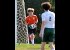 GOALKEEPER CARTER COUTCHER (#1, top left) brings the ball out for a kick against Garber in Saturday’s Bay County Tournament. --Journal Photo