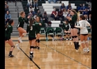 THE SPARTAN GIRLS (above) celebrate their 25-23 third-set win over Gladwin last Wednesday. They eventually lost the match 1-3. --Journal Photo