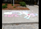 LOCAL CHALK ARTIST REBECCA LOWE created another sidewalk masterpiece last Tuesday evening in front of the Pinconning Head Start and City Hall. Head Start staff were busy on Wednesday morning taking photos of all of the kids next to the drawing. --Journal Photo