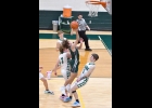 COLE BRADY (#1) drives the lane for a layup and one of the Akron-Fairgrove Vikings falls without being touched in an attempt to get a charging foul in the Spartans’ 70-37 win last Tuesday. --Journal Photo