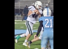 COOPER NORMAN (#44, above) and AIDEN FORK (#20, below) gained 93 and 18 yards respectively in Friday night’s rain-soaked game against the Meridian Mustangs. --Journal Photos