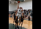 DJ LABEAN (#4) pulls down a rebound early in Pinny’s loss to Standish-Sterling last week. --Journal Photo