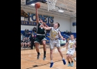 DJ LABEAN (#4) hit three 3-pointers and dropped in this breakaway shot on his way to 16 points in the Spartans’ 64-52 win. --Journal Photo