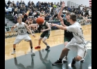ZACH JOHNSON (#21) rifles a pass to DAKOTA MAES (#11) early in the Spartan’s 47-52 loss to the Pioneers last Wednesday. --Journal Photo by Kayla Dybas