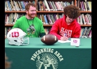 DANNY DUBAY (right) signs a Letter of Intent to play football for the Olivet University Comets next year, as Assistant Coach John Sheeran looks on. He will join another Pinconning Alumni, Alan Whiting, on the team.