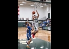 DAYNE IVEY (#55) was chased down on this breakaway against Gladwin, but easily scored a pair of his 22 points. 				