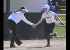 Emily Breza (#2) still seems shocked as she’s congratulated by Coach Kayla Gauthier for her second consecutive Home Run against Harrison last week. After hitting her first career dinger, then this one in the next inning, she added a third in the second game.