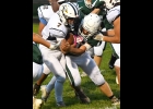 ETHAN SKRZYSINSKI (#50) wraps up the Bluejays ball-carrier in Friday night’s loss to Shepherd. --Journal Photo