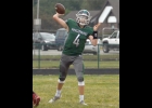 EVAN KNOCHEL (#4), debuting as the Spartan starting QB, throws toward the sideline on Thursday. --Journal Photo