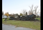 SUSPECTED ARSON FIRES on Monday night destroyed a house on Van Etten Street north of Second (top), and damaged two on Mercer Street south of Fifth. At press time the investigation was continuing.	       --Journal Photo
