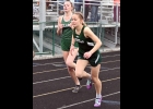 FREIDA SCHENDEL lunges forward to clinch the victory in the girls 400 Meters at Monday’s track meet with Farwell and Clare. --Journal Photo