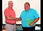 GARY YAROS (right) is congratulated by outgoing Superintendent Mike Vieau after being sworn in to fill the open PASD Board seat left vacant by Nicole Jones resignation. Yaros was a member of the Board for several years in the early 2000’s. --Journal Photo