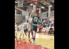 GAVIN ALMIEDA (#12, above) tries to fight off the Beaverton player to get the shot in Friday’s 69-32 loss to the Beavers. Almeida led the Spartans scoring with 10 points. --Journal Photo by Kayla Dybas