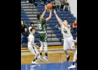 GAVIN ALMEIDA (#12) works his way to the middle of the paint for a shot during last Tuesday’s 49-48 road win over Standish-Sterling Central. Almeida scored 9 points in the game. --Journal Photo by Rachel Floyd