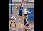 GEENA GAUTHIER (#7) battles the Gladwin player for control of the ball at the top of the net in Pinny’s 0-3 loss to the Flying G’s last Wednesday. --Journal Photo