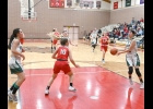 LAUREN LAURES (#3, right) takes a pass from Tori Shark (#23, left) as Brielle Herner (#10, center front), Jorja Gauthier (#22) and Grace Floyd (#20, hidden) follow up the play. Laures’ 18 points and Shark’s 12 in the third quarter alone sparked the girls 55-49 win over Beaverton in Monday’s MHSAA District 71 opener. --Journal Photo