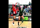 HAILEY CIANEK (#9, right) goes up for the block as the Beaverton player comes down. The ball ended up on the Beaver’s side of the net. --Journal Photos