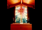 A beautiful stained glass window (right) is right behind the alter