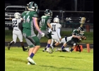 JACK BOETTCHER (#10) goes down but gets the ball across the goal line for Pinconning’s only touchdown in their 6-43 loss on Friday. --Journal Photo