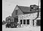 The Jankowiak Bldg, now the Pinconning Community Center, as it appeared about 1940 next to Wilson’s Cheese Shop.                           	                --Courtesy Photo